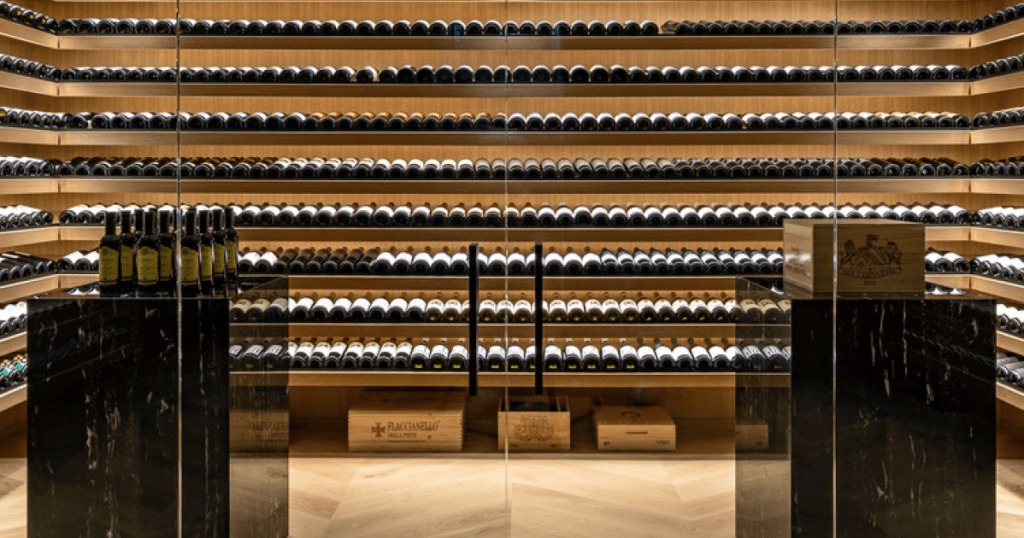 Custom-designed wine cellar with backlit shelving and climate control in luxury Toronto home.