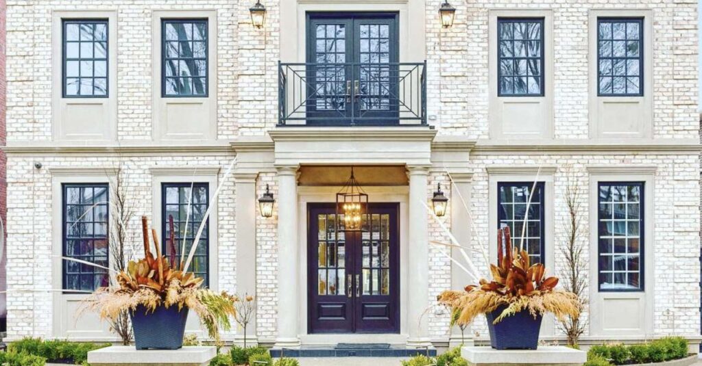 Front elevation of luxury custom Oakville residence with double-height entry and stone detailing.